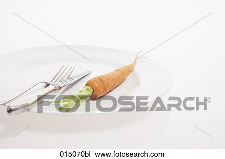 still life of carrot on table with knife and fork View Large Photo Image Stock Image - still life of carrot on table with knife and fork. Fotosearch