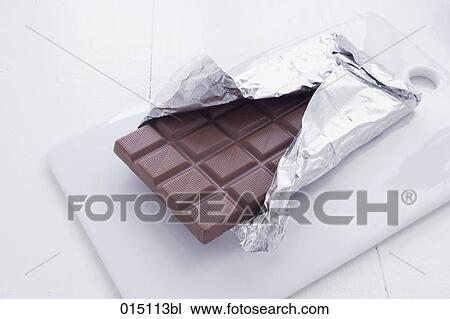 still life of chocolate wrapped in aluminium foil View Large Photo Image Stock Image - still life of chocolate wrapped in aluminium foil. Fotosearch