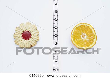 still life of cookie and piece of orange separated by tape measure View Large Photo Image Stock Image - still life of cookie and piece of orange separated by tape measure. Fotosearch