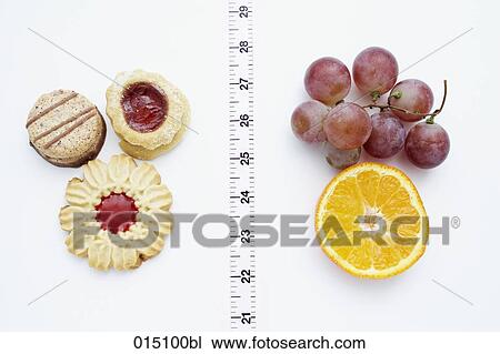 still life of cookies and fruits separated by tape measure View Large Photo Image Stock Image - still life of cookies and fruits separated by tape measure. Fotosearch