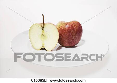 still life of cut apple on plate View Large Photo Image Stock Image - still life of cut apple on plate. Fotosearch