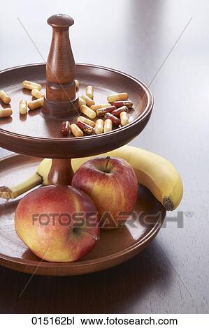 still life of fruits and capsules on tray View Large Photo Image Stock Image - still life of fruits and capsules on tray. Fotosearch