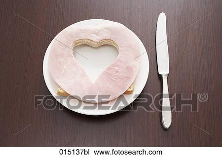 still life of ham sandwich with cut out shape of heart on plate View Large Photo Image Stock Image - still life of ham sandwich with cut out shape of heart on plate. Fotosearch