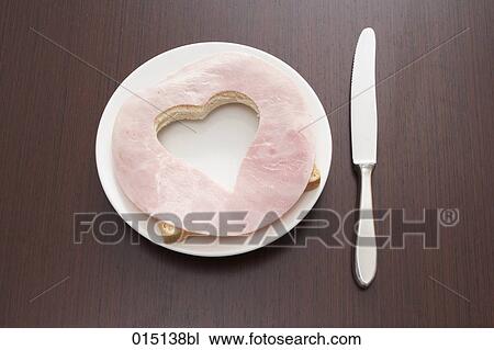 still life of ham sandwich with cut out shape of heart on plate View Large Photo Image Stock Image - still life of ham sandwich with cut out shape of heart on plate. Fotosearch