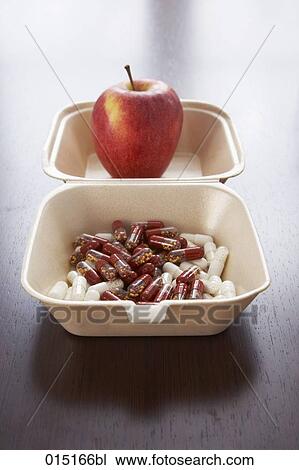still life of red apple and capsules in snack box View Large Photo Image Stock Image - still life of red apple and capsules in snack box. Fotosearch