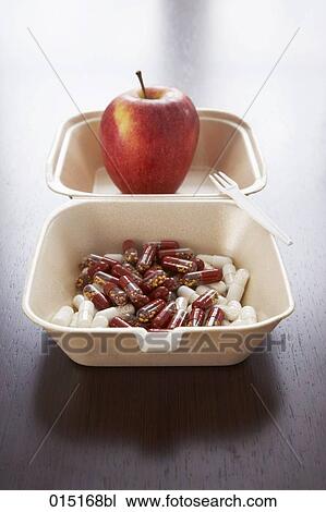 still life of red apple and capsules in snack box View Large Photo Image Stock Image - still life of red apple and capsules in snack box. Fotosearch