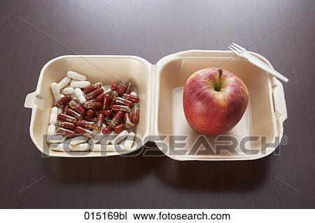 still life of red apple and capsules in snack box View Large Photo Image Stock Image - still life of red apple and capsules in snack box. Fotosearch