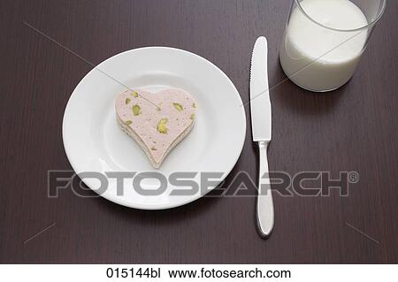 still life of sandwich with sausage cut out in shape of heart on plate and glass of milk View Large Photo Image Stock Image - still life of sandwich with sausage cut out in shape of heart on plate and glass of milk. Fotosearch