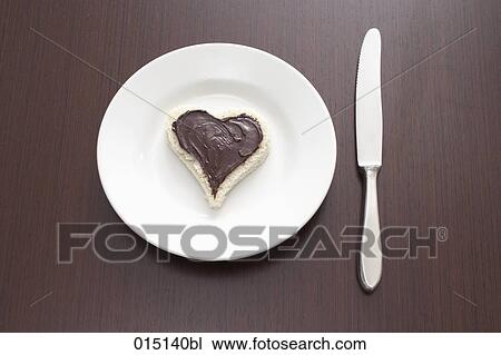 still life of sandwich with spread cut out in shape of heart on plate View Large Photo Image Stock Image - still life of sandwich with spread cut out in shape of heart on plate. Fotosearch