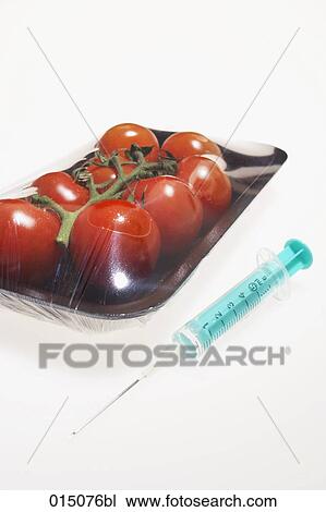 still life von tomatoes in packaging and syringe View Large Photo Image Stock Image - still life von tomatoes in packaging and syringe. Fotosearch