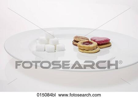 sugar cubes and cookies on plate View Large Photo Image Stock Image - sugar cubes and cookies on plate. Fotosearch