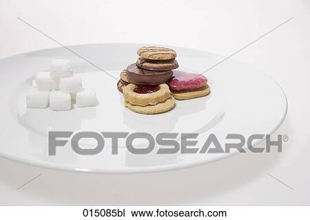 sugar cubes and cookies on plate View Large Photo Image Stock Image - sugar cubes and cookies on plate. Fotosearch