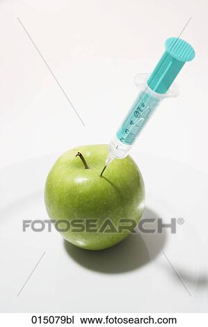 syringe injecting green apple View Large Photo Image Stock Image - syringe injecting green apple. Fotosearch