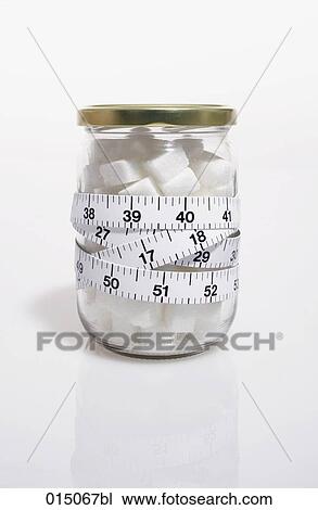 tape measure over glass filled with sugar cubes View Large Photo Image Stock Image - tape measure over glass filled with sugar cubes. Fotosearch