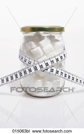 tape measure over jar filled with sugar cubes View Large Photo Image Stock Image - tape measure over jar filled with sugar cubes. Fotosearch