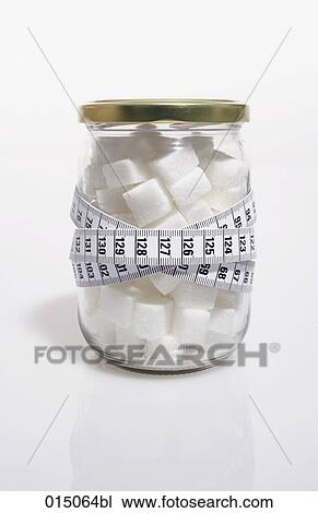 tape measure over jar filled with sugar cubes View Large Photo Image Stock Image - tape measure over jar filled with sugar cubes. Fotosearch