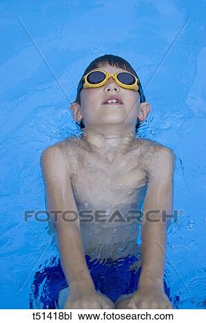 9 year old boy swimming in pool View Large Photo Image Stock Image - 9 year old boy swimming in pool. Fotosearch