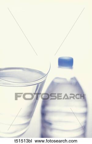 Bottle and glass of mineral water View Large Photo Image Stock Image - Bottle and glass of mineral water. Fotosearch