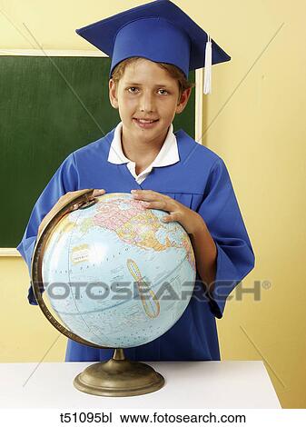 Boy in graduation clothes at school View Large Photo Image Stock Image - Boy in graduation clothes at school. Fotosearch