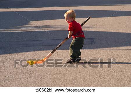 Boy playing hockey View Large Photo Image Stock Image - Boy playing hockey. Fotosearch