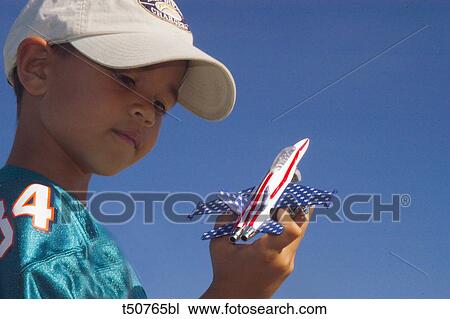 Boy playing with airplane View Large Photo Image Stock Image - Boy playing with airplane. Fotosearch