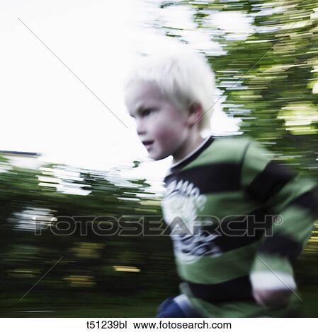 Boy running outdoors View Large Photo Image Stock Image - Boy running outdoors. Fotosearch
