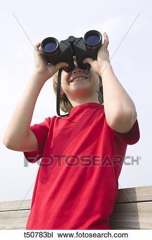 Boy using binoculars View Large Photo Image Stock Image - Boy using binoculars. Fotosearch