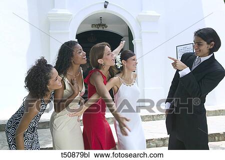 Bride and groom having fun with friends View Large Photo Image Stock Image - Bride and groom having fun with friends. Fotosearch