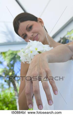 Bride showing wedding ring View Large Photo Image Stock Image - Bride showing wedding ring. Fotosearch