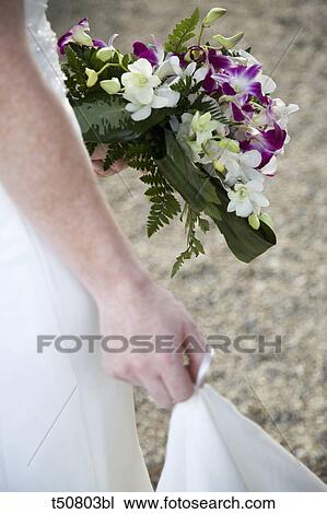 Bride with bouquet, close up View Large Photo Image Stock Image - Bride with bouquet, close up. Fotosearch
