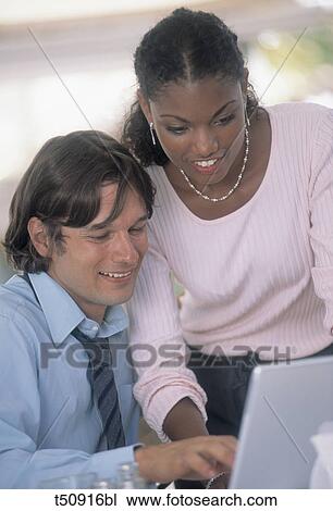Buisnesspeople working with laptop View Large Photo Image Stock Image - Buisnesspeople working with laptop. Fotosearch