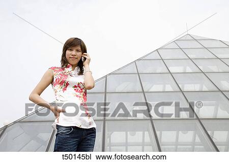 China, Shanghai, Chinese woman talking on telephone booth View Large Photo Image Stock Image - China, Shanghai, Chinese woman talking on telephone booth. Fotosearch