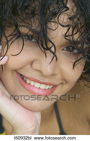 Close up of a smiling woman View Large Photo Image Stock Image - Close up of a smiling woman. Fotosearch
