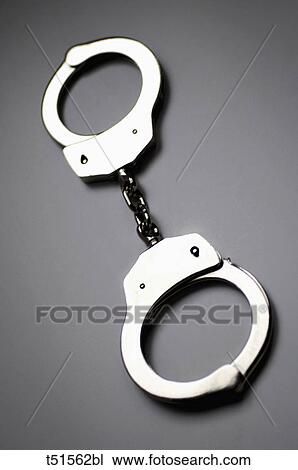 Close up of handcuffs View Large Photo Image Stock Image - Close up of handcuffs. Fotosearch