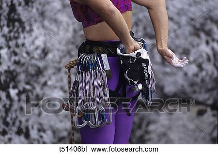 Close up of rock climbing equipment on a female climber View Large Photo Image Stock Image - Close up of rock climbing equipment on a female climber. Fotosearch