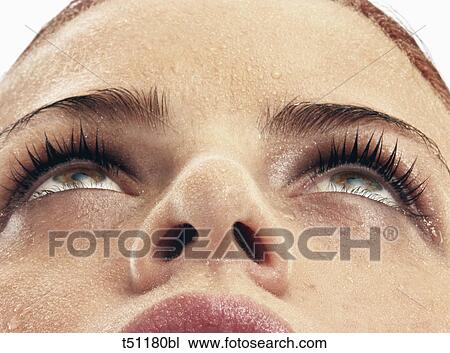 Stock Image - Close up of woman's face. Fotosearch