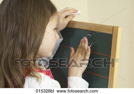 Stock Image - close-up of young girl erasing mistake at blackboard. Fotosearch