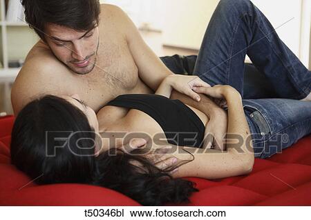 Couple at home lying on airbed View Large Photo Image Stock Image - Couple at home lying on airbed. Fotosearch