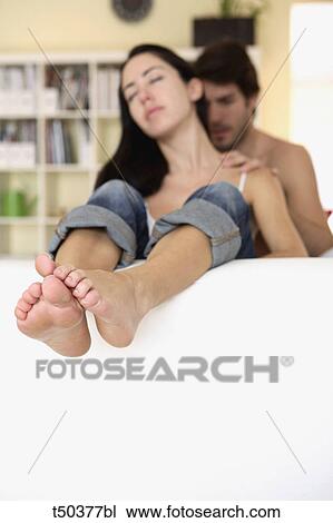 Couple at home: man massaging woman's shoulders View Large Photo Image Stock Image - Couple at home: man massaging woman's shoulders. Fotosearch