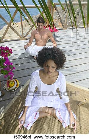 Couple doing yoga View Large Photo Image Stock Image - Couple doing yoga. Fotosearch