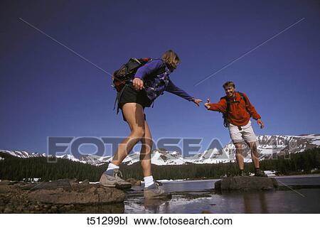 Couple hiking View Large Photo Image Stock Image - Couple hiking. Fotosearch