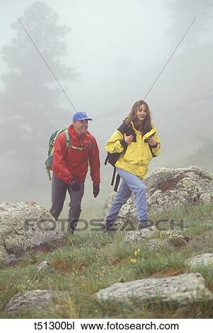 Couple hiking View Large Photo Image Stock Image - Couple hiking. Fotosearch