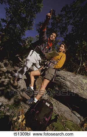 Stock Image - Couple hiking. Fotosearch