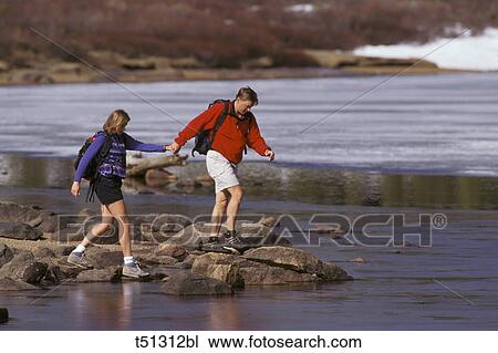 Couple hiking View Large Photo Image Stock Image - Couple hiking. Fotosearch