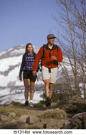 Couple hiking View Large Photo Image Stock Image - Couple hiking. Fotosearch