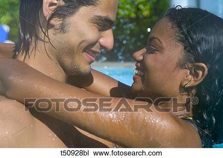 Couple in swimming pool View Large Photo Image Stock Image - Couple in swimming pool. Fotosearch
