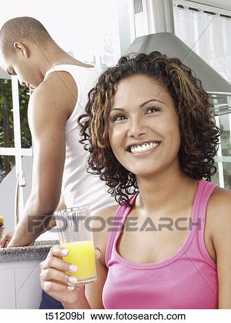 Couple in the kitchen View Large Photo Image Stock Image - Couple in the kitchen. Fotosearch