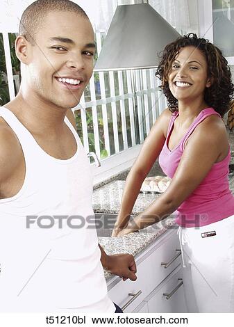 Couple in the kitchen View Large Photo Image Stock Image - Couple in the kitchen. Fotosearch