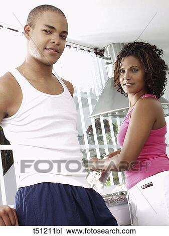 Couple in the kitchen View Large Photo Image Stock Image - Couple in the kitchen. Fotosearch