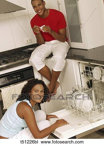 Couple in the kitchen View Large Photo Image Stock Image - Couple in the kitchen. Fotosearch